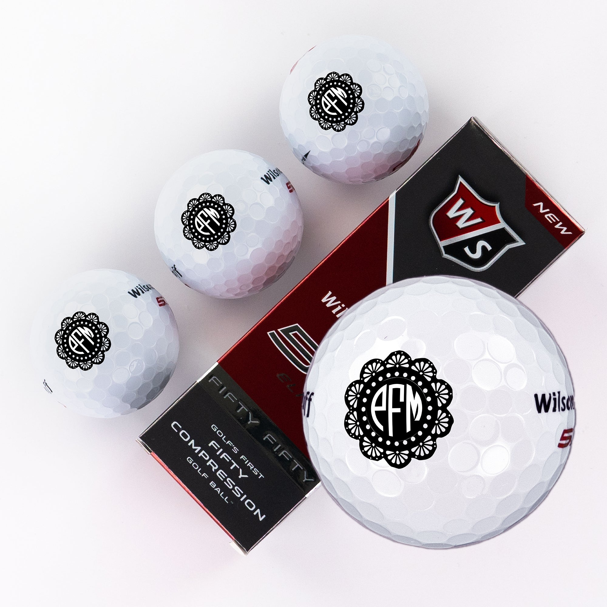 Three Piece Golf Balls with Flower Petal Monogram Design